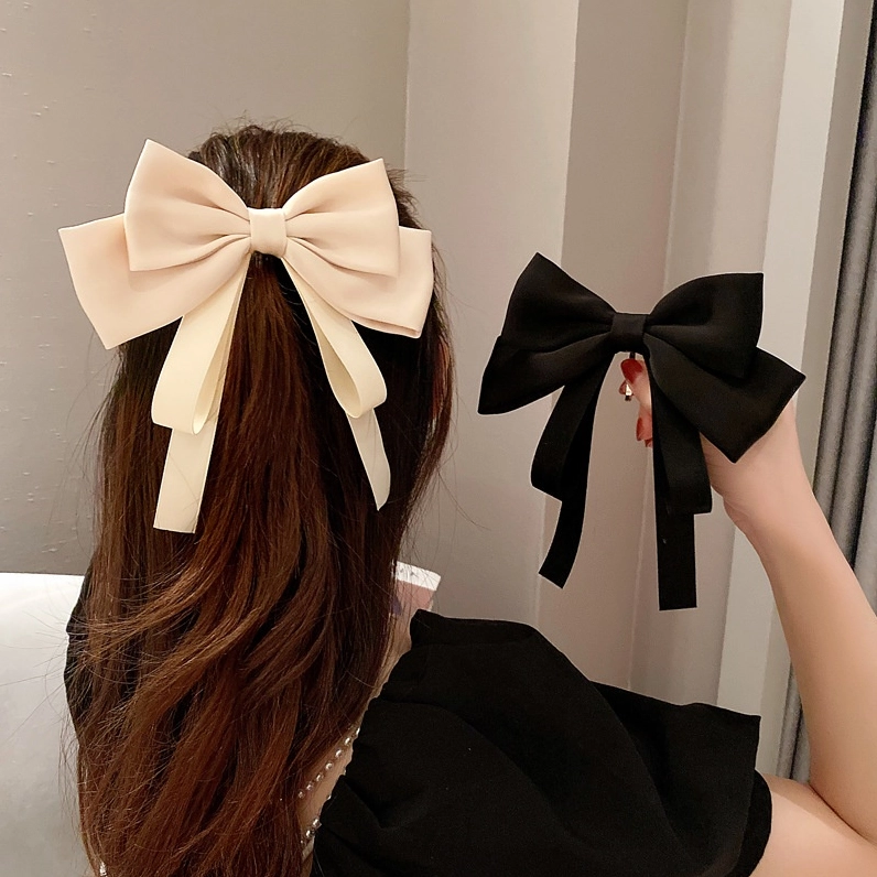 Kẹp tóc nơ lụa với gam màu pastel ngọt ngào